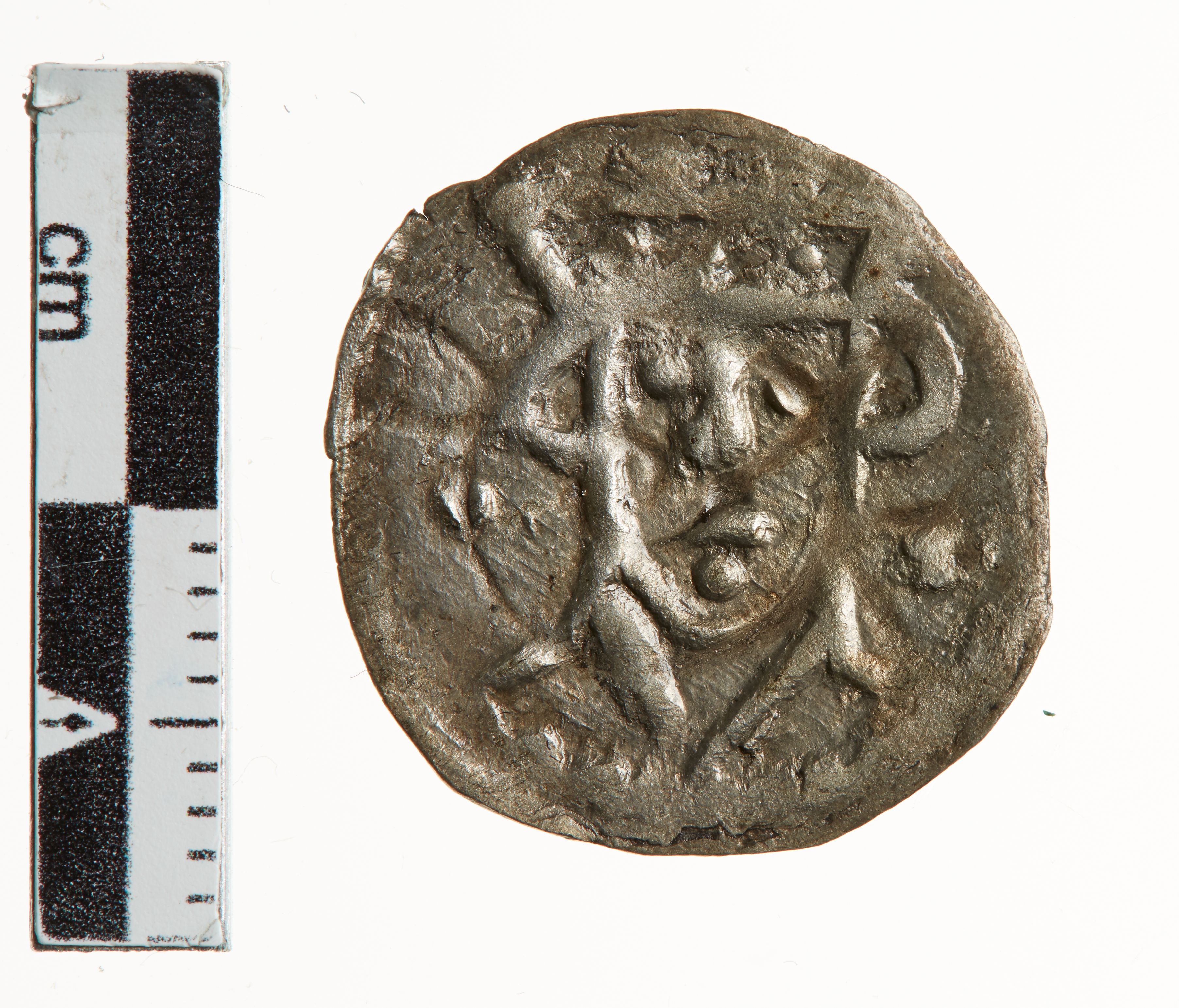 Mønt med kongens ansigt