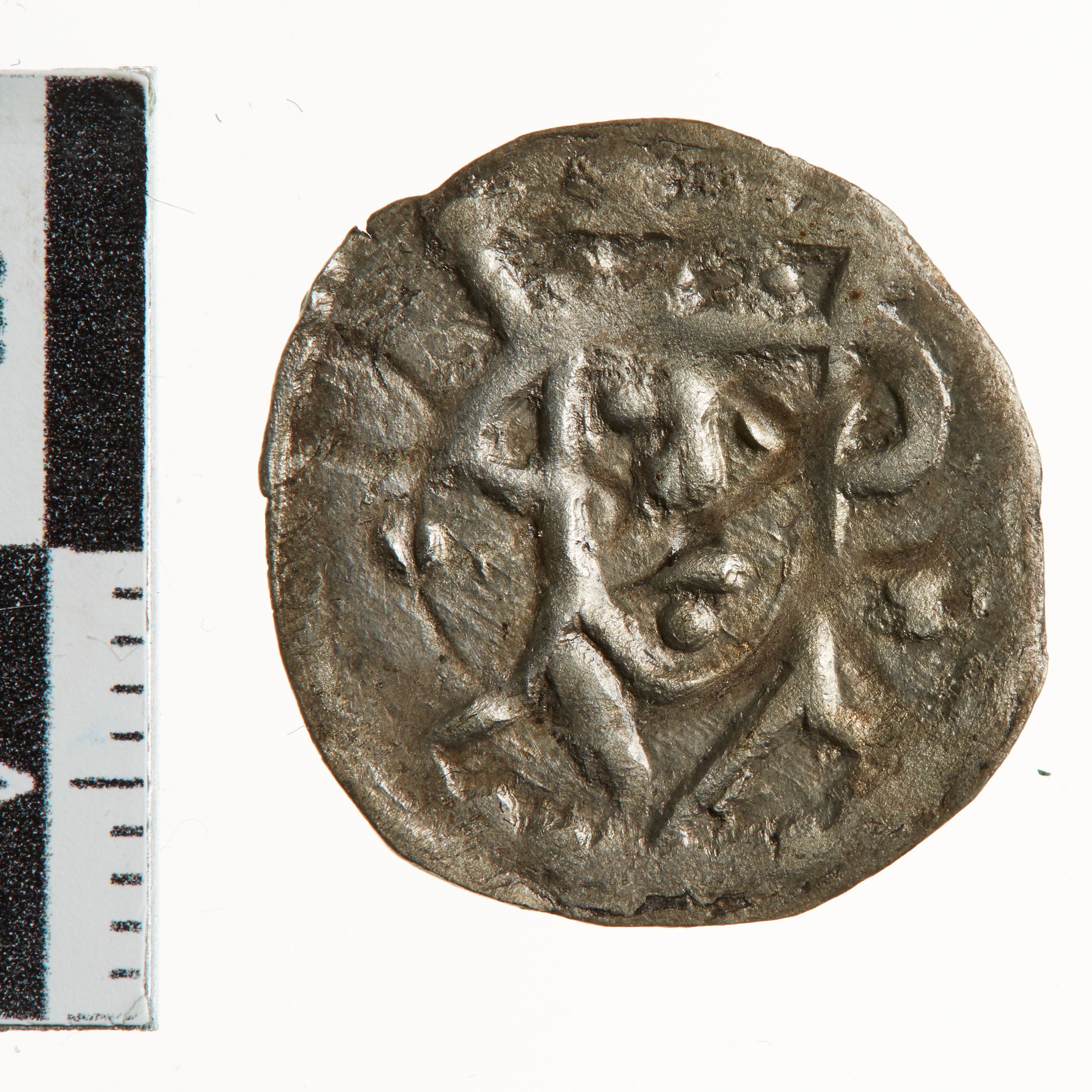 Mønt med kongens ansigt