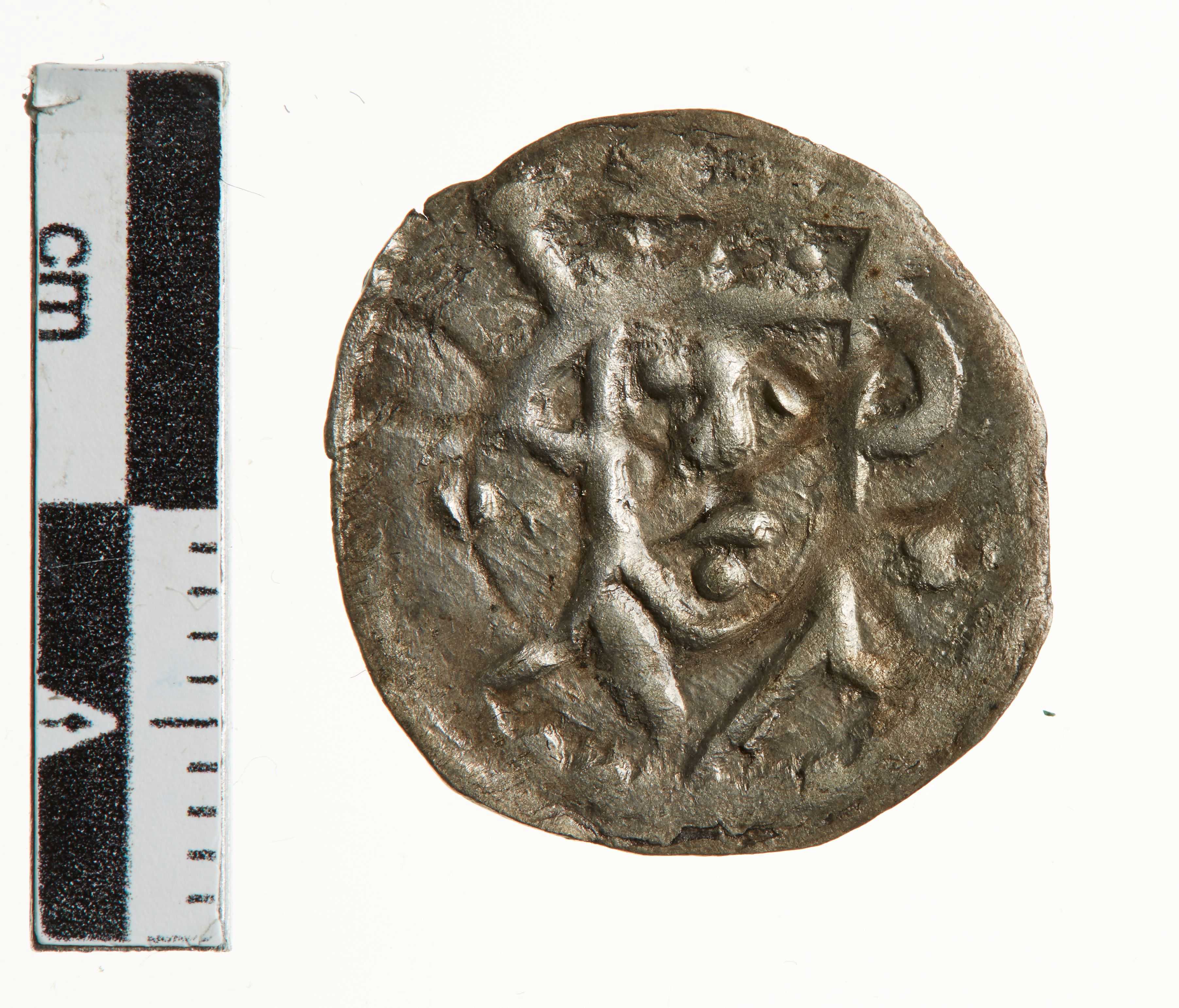 Mønt med kongens ansigt